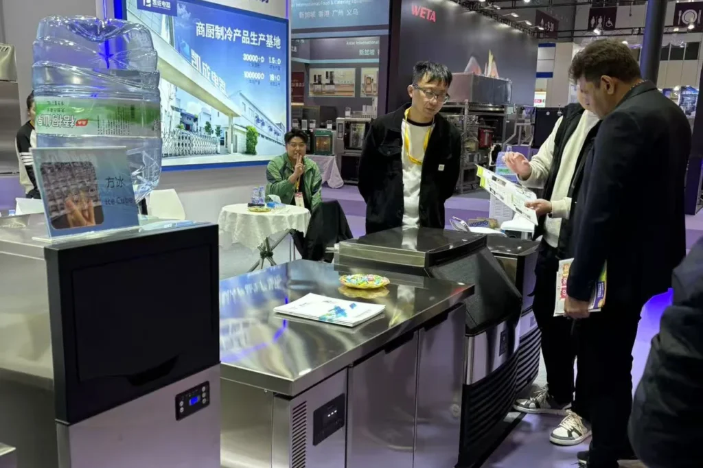 Professional buyers inspecting KAISON commercial ice machines at HOTELEX Shenzhen 2024
