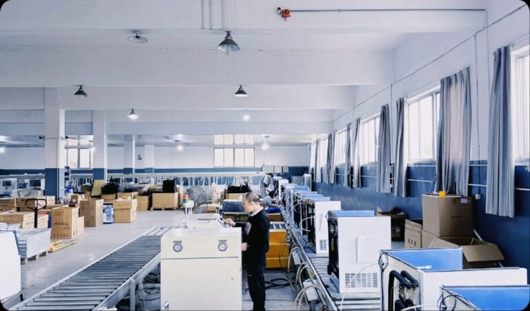 A technician testing commercial ice machines on the KAISON production floor